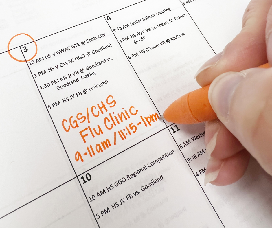Person writing on a calendar with the date October 3rd circled. Text in Orange reads "CGS/CHS Flu Clinic 9-11 am/11:15 am - 1 pm"