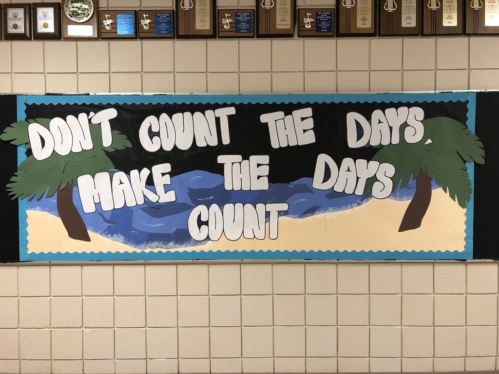 Bulletin Board with sand, ocean and palm trees in the background with the text, "Don't count the days, make the days count."
