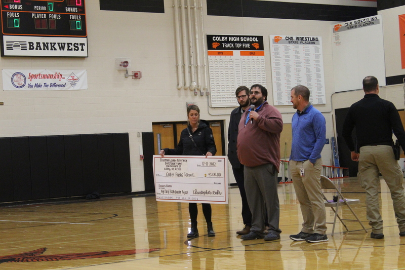 Christopher Rohr, Thomas County Attorney presents check to AgEdTechBuilding.